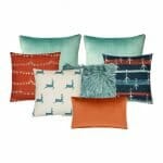 Vibrant red and green Christmas cushion set in varying textures