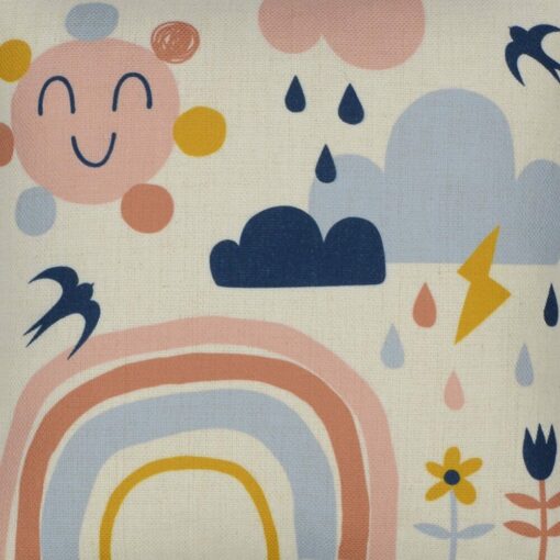 Close-up image of colourful kids cushion with rainbow, clouds and flowers print