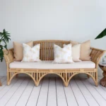 A set of 5 beige outdoor sofa cushions in a lounge creating a chic and tranquil ambiance.