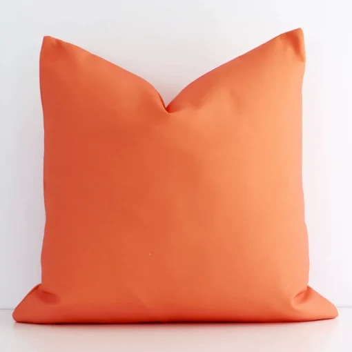 Lovely bold coral cushion made from outdoor fabric and in an elegant square shape.