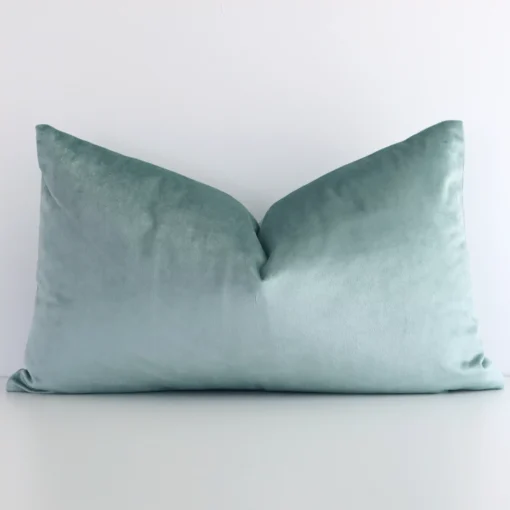 An eye-catching velvet rectangular cushion cover featuring a hue that is mint. It has a charming solid colour style.