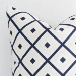 Lateral view of front and back panels of this geometric outdoor cushion cover in a square size and with navy and beige colouring.