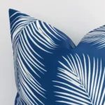 A magnified shot of a palm outdoor cushion cover in a square size and a blue colour.