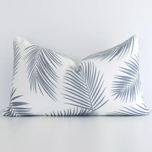 A hero shot of a palm styled rectangle cushion cover. It is made from a deluxe outdoor fabric and features a grey colour.