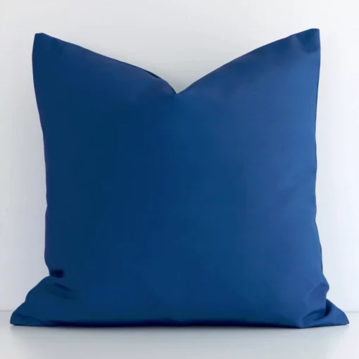 A gorgeous outdoor square cushion in blue. It has an eye-catching soli-coloured design.