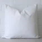 A waterproof outdoor square cushion in white.