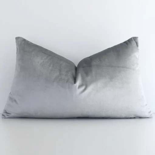 A stunning rectangular velvet cushion in a silver colour. It has an exquisite solid colour design.